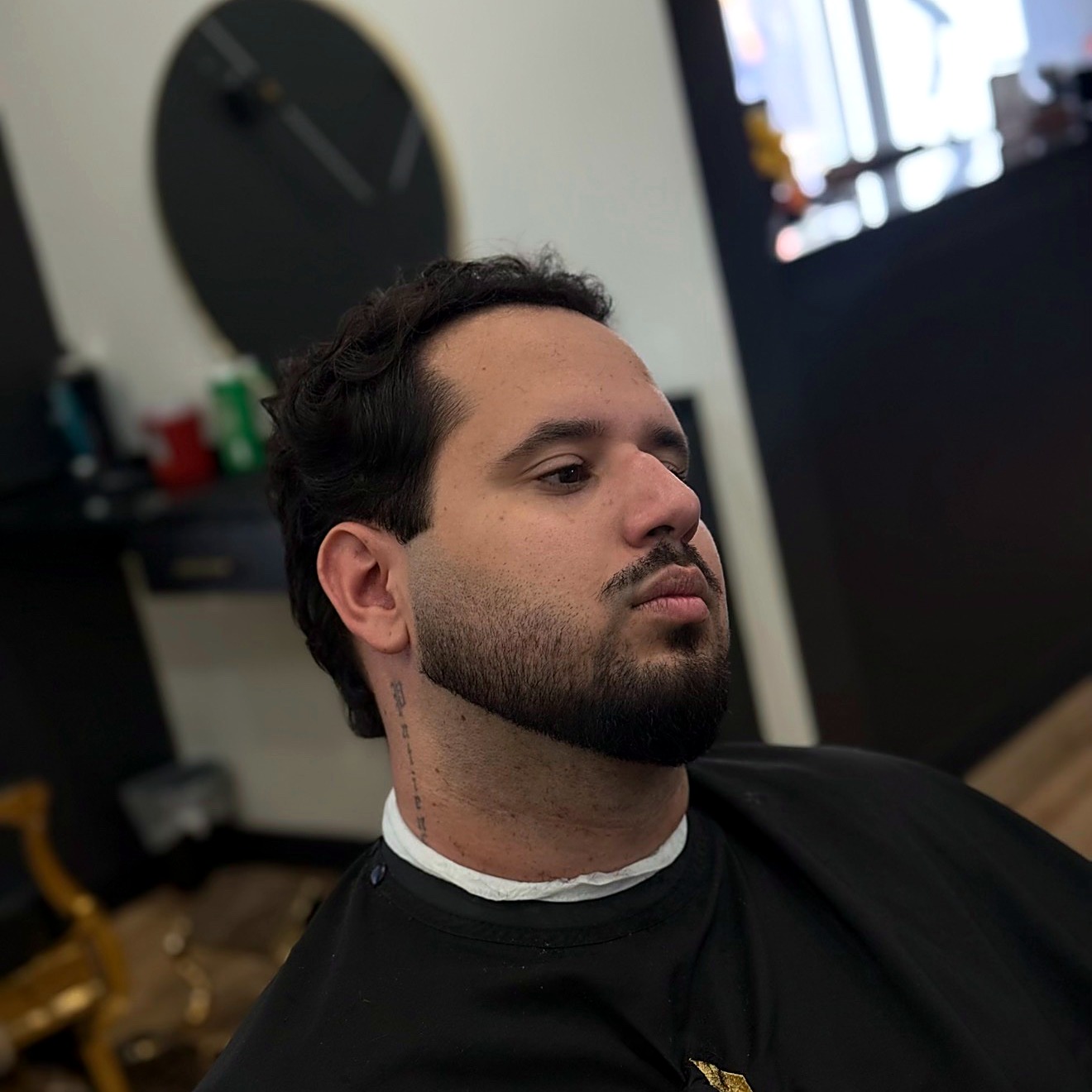 Barber styling a client's hair